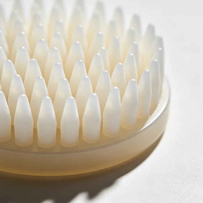 a close-up of a silicone brush head with soft conical bristles